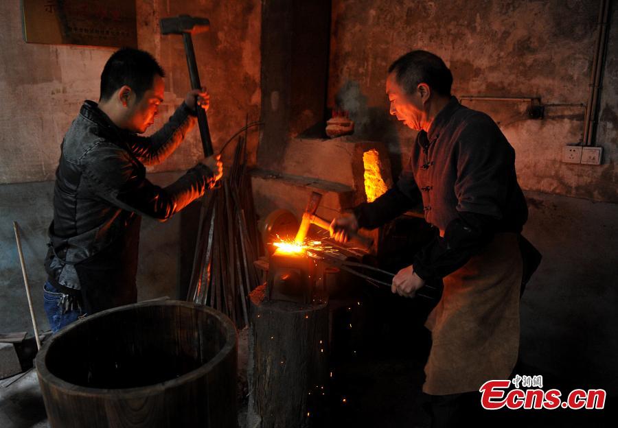 <?php echo strip_tags(addslashes(A sword-making workshop in Songxi County in East China’s Fujian Province. Zhanlu Mountain in southern Songxi, well-known for its long history and strong culture, is said to have been the home to the most revered among top five most famous swords in ancient China. Chinese poets in the Tang and Song dynasties, including Du Fu, Li Bai and Su Shi, penned lines in praise of the Zhanlu swords, nicknamed as the “No. 1 Sword Under the Heaven”. In 1985, local craftsmen went to huge efforts, reading historical literature and working with research institutes in Beijing and Nanjing, to finally craft Zhanlu swords by hand again. Making a Zhanlu sword involves more than 100 time-consuming steps, including forging, quenching and grinding. (Photo: China News Service/Zhang Bin))) ?>