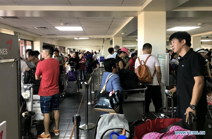 Chinese tourists wait to fly back home in Saipan, the Commonwealth of the Northern Mariana Islands (CNMI), Oct. 28, 2018. Some 1,500 Chinese tourists trapped in Saipan by Super Typhoon Yutu started to fly back home on Sunday. (Xinhua)
