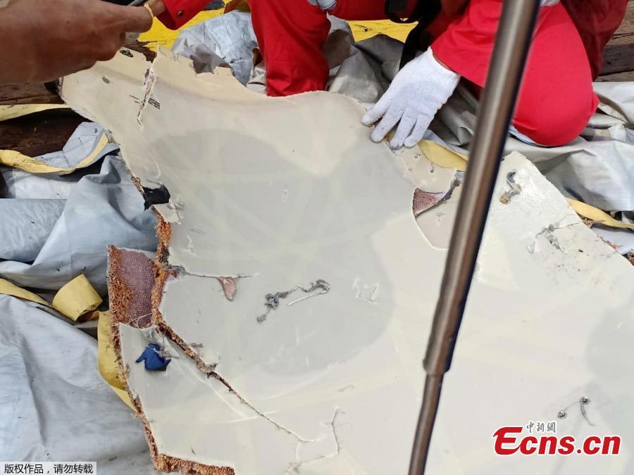 Workers of PT Pertamina examine recovered debris of what is believed from the crashed Lion Air flight JT610, onboard Prabu ship owned by PT Pertamina, off the shore of Karawang regency, West Java province, Indonesia, Oct. 29, 2018. An aircraft with 188 people on board is believed to have sunk after crashing into the sea off Indonesia’s island of Java on Monday, shortly after takeoff from the capital on its way to the country’s tin-mining hub, officials said. (Photo/Agencies)