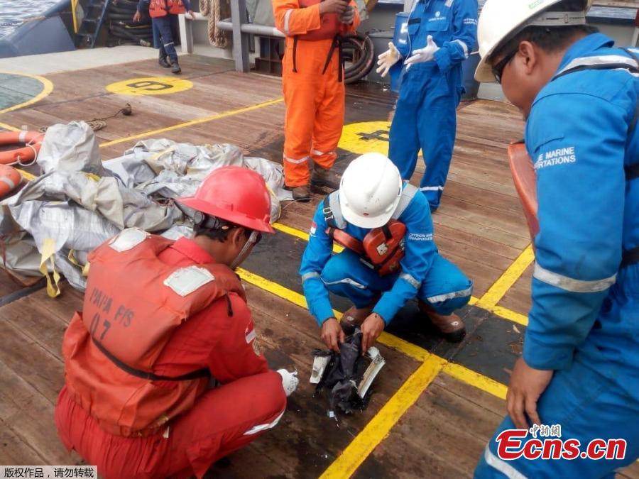 Workers of PT Pertamina examine recovered debris of what is believed from the crashed Lion Air flight JT610, onboard Prabu ship owned by PT Pertamina, off the shore of Karawang regency, West Java province, Indonesia, Oct. 29, 2018. An aircraft with 188 people on board is believed to have sunk after crashing into the sea off Indonesia’s island of Java on Monday, shortly after takeoff from the capital on its way to the country’s tin-mining hub, officials said. (Photo/Agencies)
