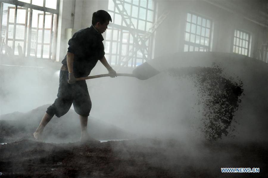 Workers process sorghum grains at a distillery in Maotai town in the city of Renhuai in southwest China\'s Guizhou Province, Oct. 23, 2018. Maotai is a small town in Renhuai City in mountainous Guizhou. What distinguishes it from other Chinese small towns is that it produces a famous brand of Chinese liquor Moutai, which often served on official occasions and at state banquets. The spirit, made from sorghum and wheat, takes up to five years for the whole production process, involving nine times of steaming, eight times of fermentation and seven times of distillation, before aged in clay pots. Moutai is also considered a luxury item that has long been a popular gift. China\'s alcohol industry earned about 1 trillion yuan in revenue in 2017. The total profits rose by 36 percent year on year to over 100 billion yuan, according to China National Light Industry Council. (Xinhua/Yang Wenbin)