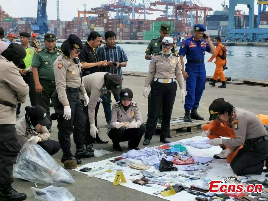 Rescue workers lay out recovered belongings believed to be from the crashed Lion Air flight JT610 at Tanjung Priok port in Jakarta, Indonesia, Oct. 30, 2018. Indonesia on Tuesday stepped up a search for an airliner that plunged into the sea with all 189 aboard feared dead, deploying underwater beacons to trace its black box recorders and uncover why an almost-new plane crashed minutes after take-off. (Photo: China News Service/Lin Yongchuan)