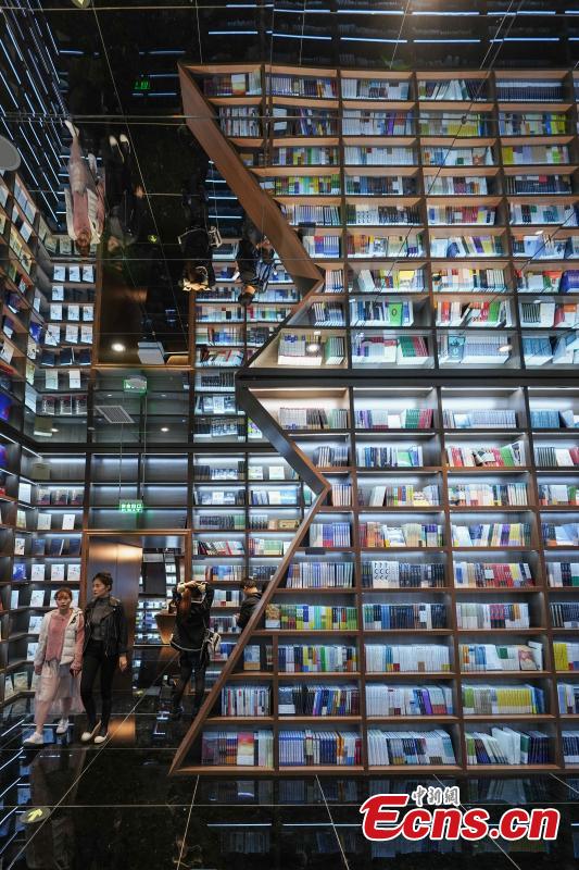 <?php echo strip_tags(addslashes(Neatly-arranged books are set on shelves at a new outlet of the Zhongshuge bookstore in Guiyang City, Southwest China’s Guizhou Province, Oct. 29, 2018. The design of the store took inspiration from the karst landforms of the province and features other signature tourism and cultural icons, making it a fresh attraction for local readers and other visitors. (Photo: China News Service/He Junyi))) ?>