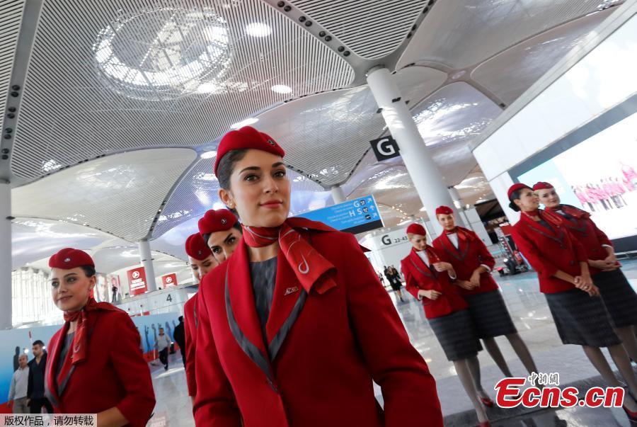 Turkish Airlines stewardesses pose at a terminal of the Istanbul\'s new airport prior to the official opening ceremony, in Istanbul, Turkey, Oct. 29, 2018. (Photo/Agencies)