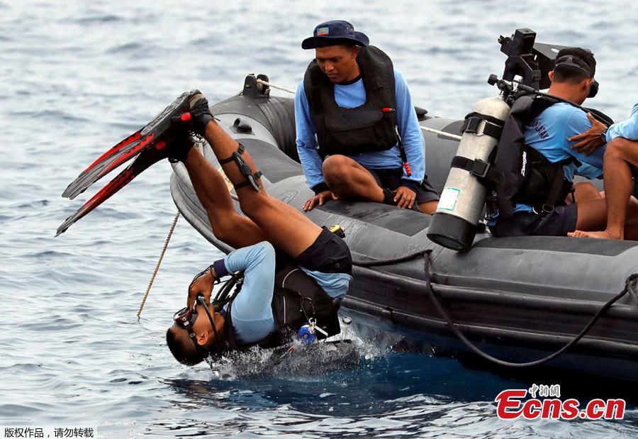 <?php echo strip_tags(addslashes(An Indonesian navy soldier jumps to dive at the location of the Lion Air flight JT610 crash off the north coast of Karawang regency, West Java province, Indonesia, Oct. 30, 2018.  The search continued Tuesday for bodies and the 
