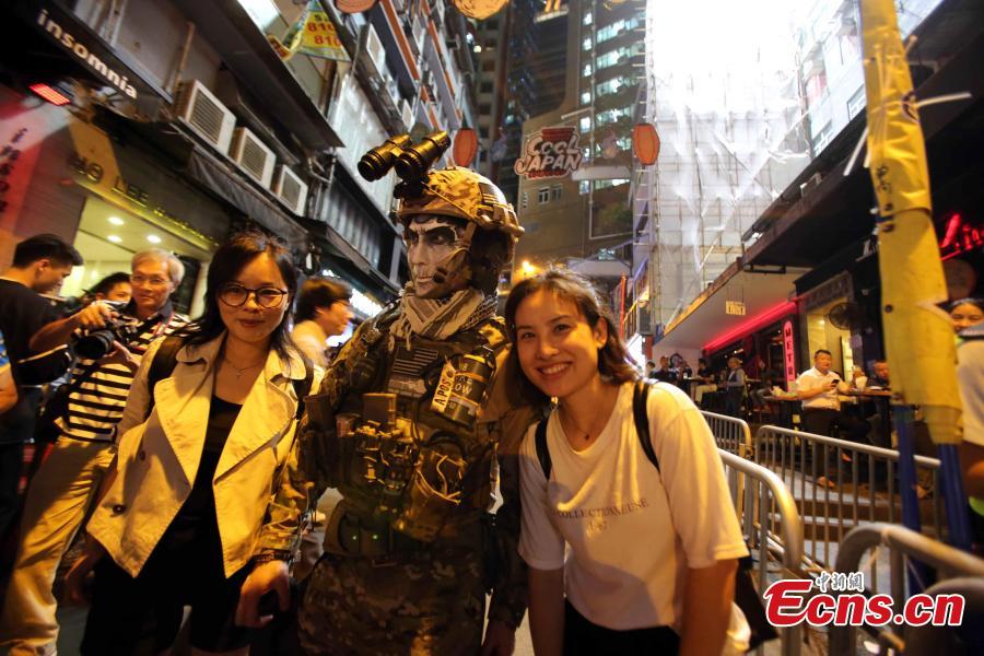 People dressed in Halloween costumes celebrate the western festival at Lan Kwai Fong in Hong Kong on October 31, 2018. (Photo: China News Service/Hong Shaokui)