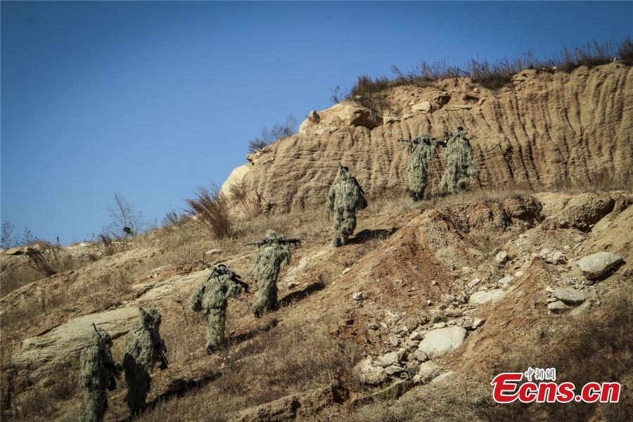 Snipers from a special unit of the Chinese People\'s Armed Police Force sharp their skills during a training at Songshan Mountain, Central China’s Henan province.  (Photo: China News Service/ Zhao Hongtao)