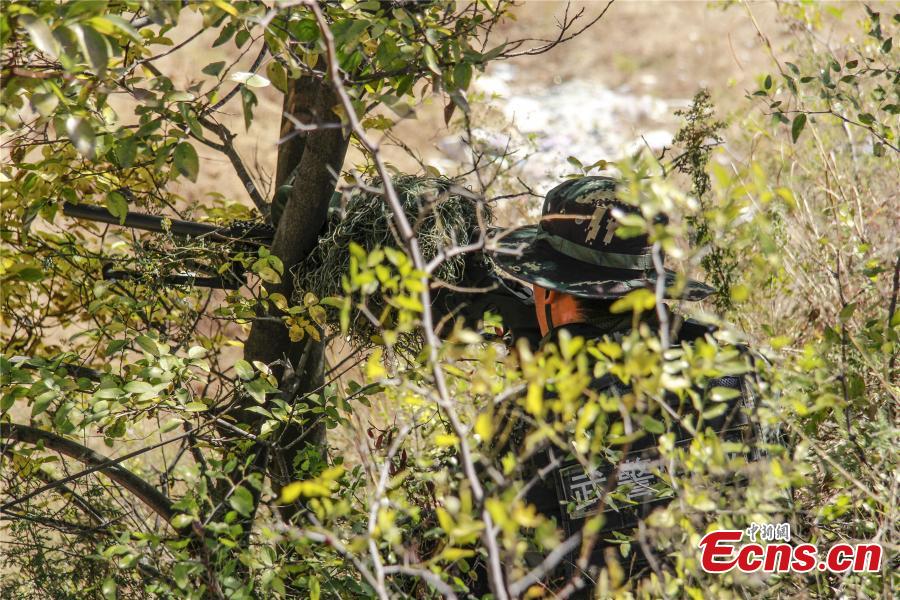 Snipers from a special unit of the Chinese People\'s Armed Police Force sharp their skills during a training at Songshan Mountain, Central China’s Henan province.  (Photo: China News Service/ Zhao Hongtao)