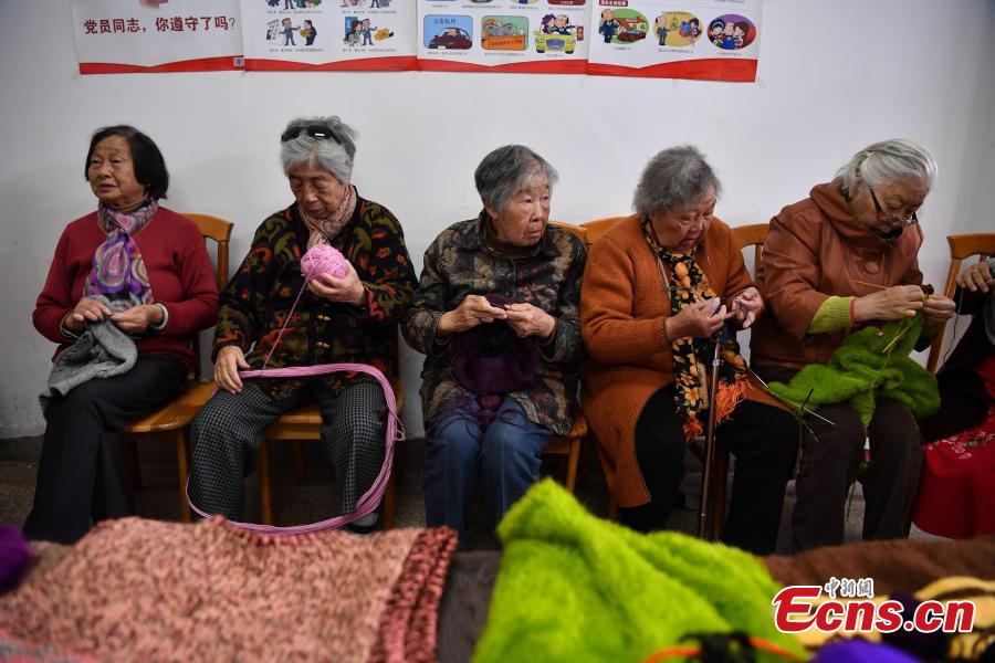 Old ladies knit sweaters for children in poor areas in Kunming, Southwest China’s Yunnan province on November 1, 2018. The ladies, who are retirees of a local hospital, formed a knitting club to make and send out cozy sweaters for the needy. A total of 19 knitters, whose average age is 75, have worked tirelessly in the past nine months, knitting 184 warm sweaters in their spare time for needy children in a village in Qiaojia county of the province. (Photo: China News Service/ Liu Ranyang)