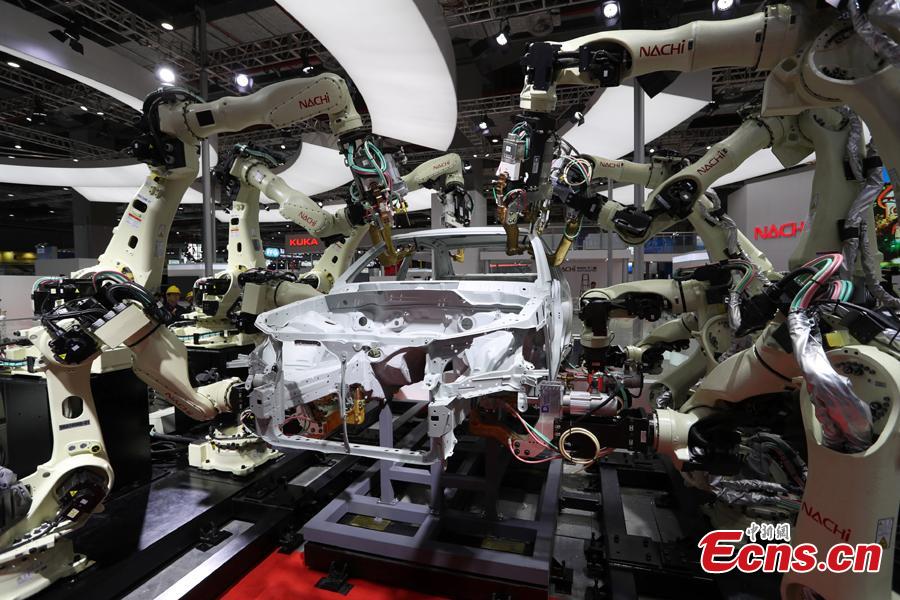 This photo taken on Nov. 2, 2018 shows intelligent and high-end equipment are in place at the exhibition hall of the first China International Import Expo (CIIE). Covering a total exhibition area of 60,000 square meters, it will showcase large and heavy products in the technology-intensive fields of aerospace, robotics and automation. More than 400 enterprises from 40 countries and regions all over the world will participate in this expo. (Photo: China News Service/Zhang Hengwei)