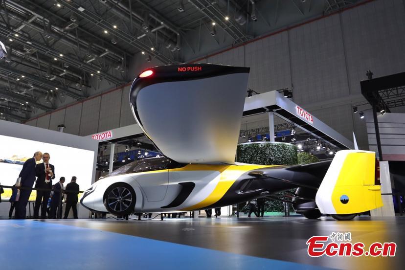 A flying car developed by AeroMobil, a Slovakian advanced engineering company is shown at the China International Import Expo (CIIE) opened in Shanghai on November 5, 2018. Integrating innovation in automotive and aerospace fields, the car with wings applies automotive safety standards together with lightweight materials and advanced aerodynamics. This will provide owners with true freedom of movement in the air and on the ground, providing electric propulsion on the road coupled with a lightweight internal combustion engine to provide propulsion in the air. (Photo: China News Service/ Zhang Hengwei)