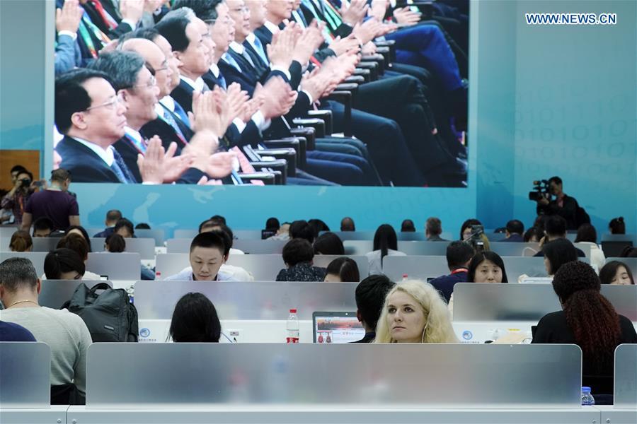 Journalists work at the media center of the first China International Import Expo (CIIE) in Shanghai, east China, Nov. 5, 2018. The first CIIE opened here on Monday and has drawn much attention from domestic and international media. (Xinhua/Shen Bohan)