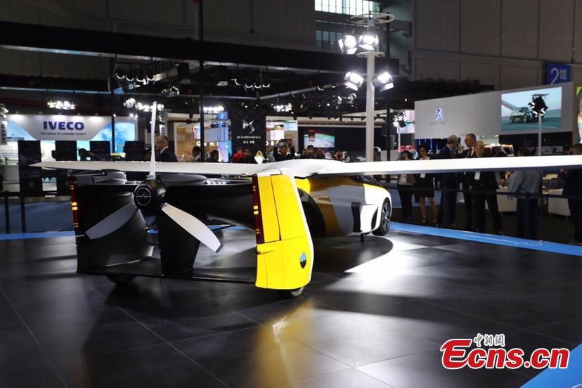 A flying car developed by AeroMobil, a Slovakian advanced engineering company is shown at the China International Import Expo (CIIE) opened in Shanghai on November 5, 2018. Integrating innovation in automotive and aerospace fields, the car with wings applies automotive safety standards together with lightweight materials and advanced aerodynamics. This will provide owners with true freedom of movement in the air and on the ground, providing electric propulsion on the road coupled with a lightweight internal combustion engine to provide propulsion in the air. (Photo: China News Service/ Zhang Hengwei)