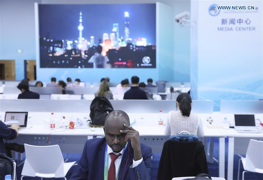 Journalists work at the media center of the first China International Import Expo (CIIE) in Shanghai, east China, Nov. 5, 2018. The first CIIE opened here on Monday and has drawn much attention from domestic and international media. (Xinhua/Lan Hongguang)
