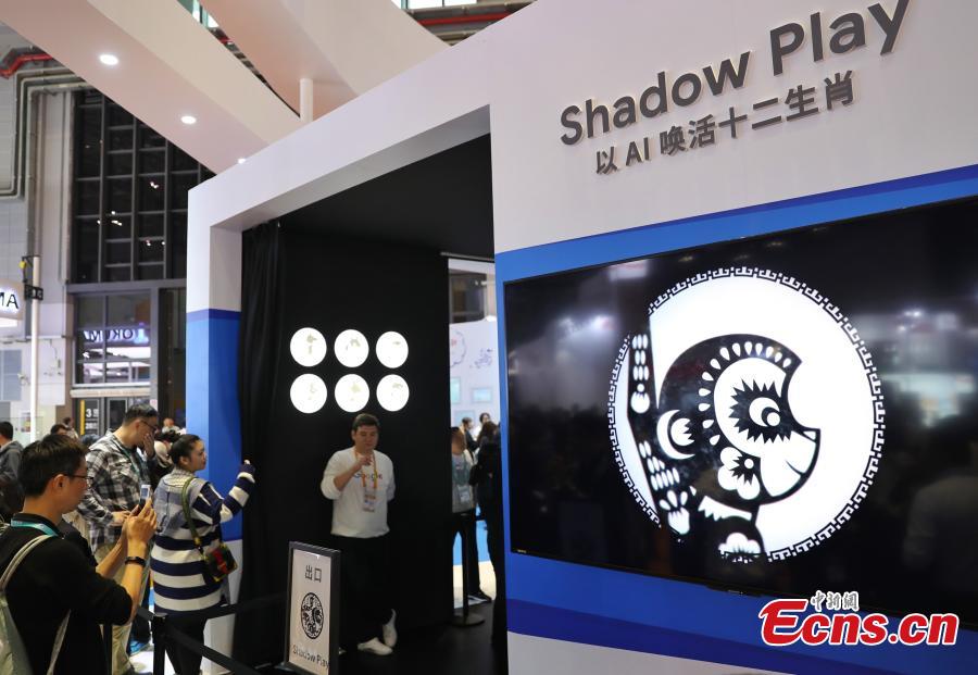 Using TensorFlow, an open source machine learning platform, Google’s ShadowPlay enables visitors to transform shadow figures from hand gestures into digital animations at the first China International Import Expo (CIIE) in Shanghai, east China, Nov. 7 2018. The installation, built using TensorFlow, uses AI to recognize a person’s hand gestures and then magically transform the shadow figure into digital animations representing the 12 animals of the Chinese zodiac and in an interactive show. (Photo: China News Service/Zhang Hengwei)