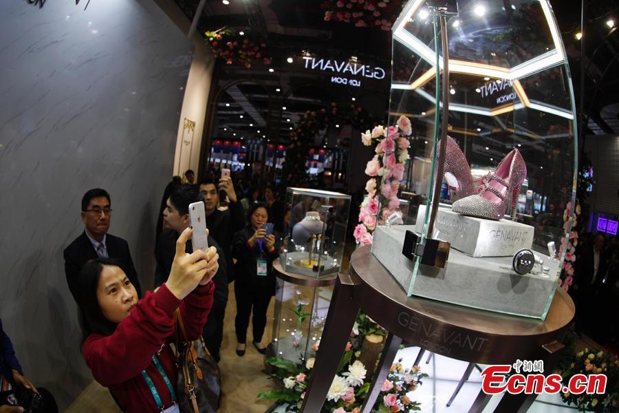A pair of diamond shoes worth $4.35 million made their debut at China International Import Expo (CIIE) in Shanghai. They are designed and made by couture shoe designer Jimmy Choo. (Photo: China News Service/Du Yang)