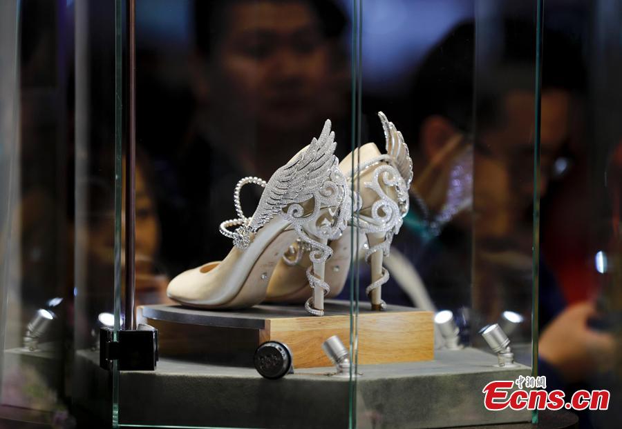 A pair of shoes with jewelries are exhibited at China International Import Expo (CIIE) in Shanghai. (Photo: China News Service/Du Yang)
