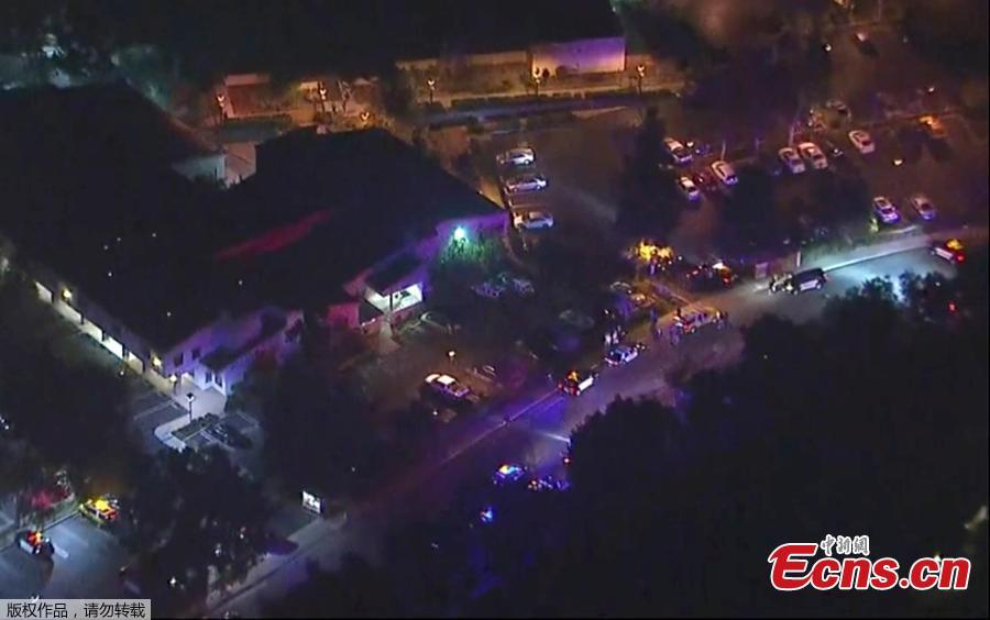 In this image made from aerial video, police vehicles block an intersection in the vicinity of a shooting in Thousand Oaks, California, early Thursday, Nov. 8, 2018. At least 12 people were killed and multiple people were injured after a man opened fire in Southern California bar late Wednesday. The gunman killed himself at the spot. (Photo/Agencies)