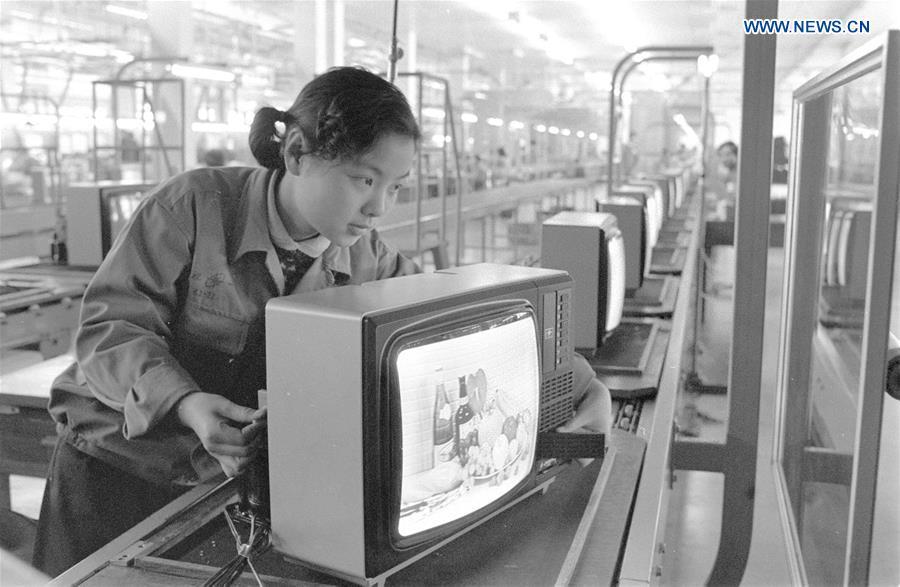 <?php echo strip_tags(addslashes(Undated photo shows a worker checking a television set in Shanghai, east China. Shanghai No. 1 television factory in February 1982 put into pilot production of color TV with the assembling equipment imported from Japan. (Xinhua/Yang Putao))) ?>