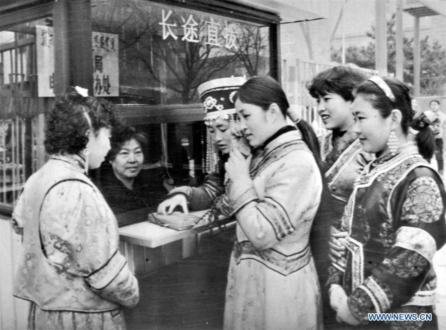 <?php echo strip_tags(addslashes(A woman of Mongolia ethnic group makes a long-distance phone call at a public phone booth in Hohhot, north China's Inner Mongolia Autonomous Region, Dec. 7, 1992. More than four decades of sound economic growth from 1978, the starting year of the reform and opening-up policy, has fundamentally lifted life quality of 1.3 billion Chinese, who are now able to enjoy the 