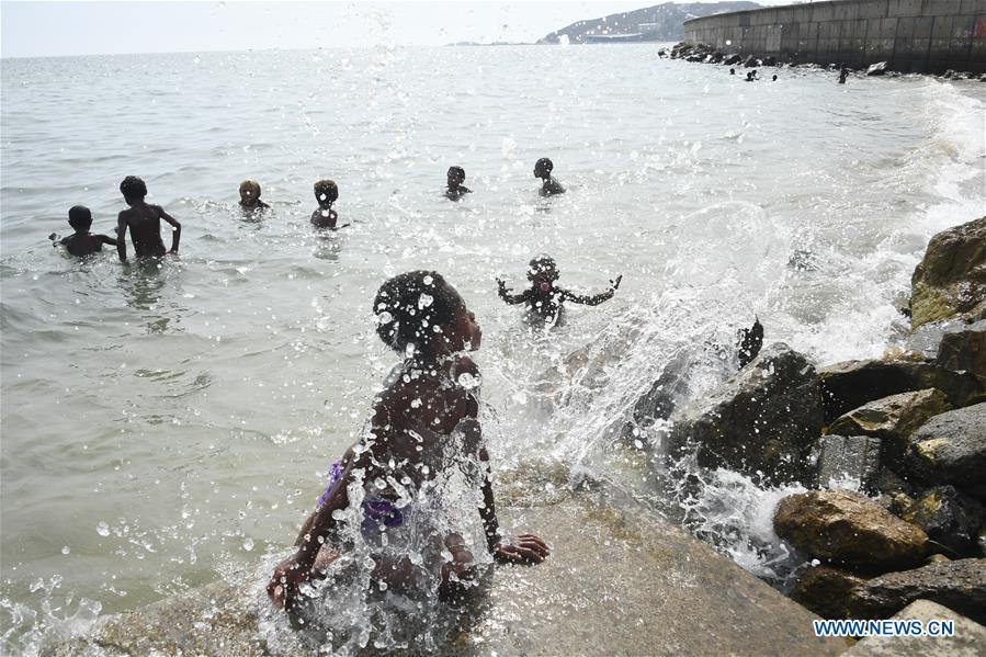 Children play on the sea shore in Port Moresby, Papua New Guinea, on Nov. 11, 2018. Leaders from the Asia-Pacific economies are gathering in Port Moresby, the capital of Papua New Guinea for the Asia-Pacific Economic Cooperation (APEC) Leaders\' Week on Nov. 12-18. (Xinhua/Lui Siu Wai)