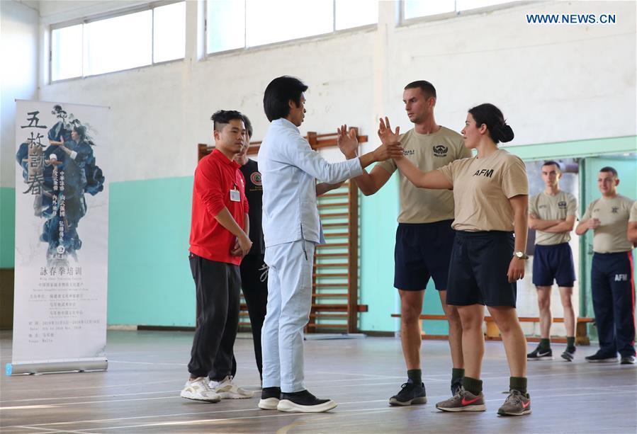 Wing Chun master Zheng Zujie (2nd L) teaches soldiers of Armed Forces of Malta (AFM) Wing Chun moves in Luca, Malta, on Nov. 13, 2018. In cooperation with the Malta Martial Arts Association and the local martial arts community, China Cultural Center in Malta invited Zheng Zujie, a martial arts instructor and Wing Chun master from China, to provide Wing Chun Military Fighting Training Course for the AFM on Tuesday. (Xinhua/Yuan Yun)
