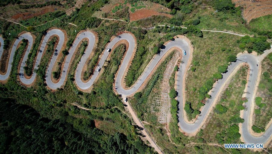 <?php echo strip_tags(addslashes(Aerial photo taken on Nov. 14, 2018 shows a winding road on a mountain in Yiliang County of Kunming, southwest China's Yunnan Province. The famous winding road has 68 bends in a length of 6.3 kilometers.(Xinhua/Lin Yiguang))) ?>