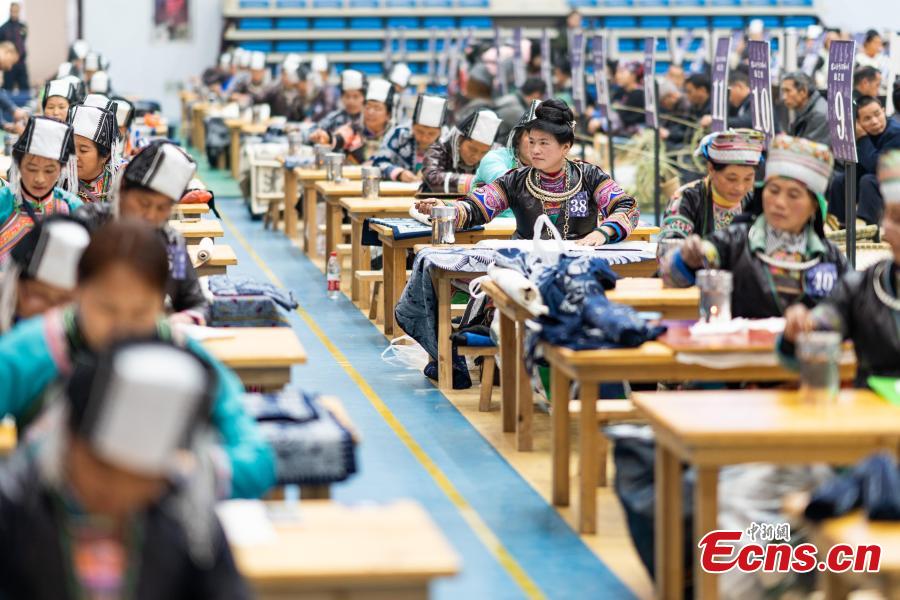 <?php echo strip_tags(addslashes(A competitor presents embroidery skills during a manual skills competition held in Rongjiang County of Qiandongnan Miao and Dong Autonomous Prefecture, southwest China's Guizhou Province, on Nov. 15, 2018. A number of artisans from the county participated in the competition in aspects of spinning, weaving, wax printing, embroidery and so on.(Photo: China News Service/ He Junyi))) ?>