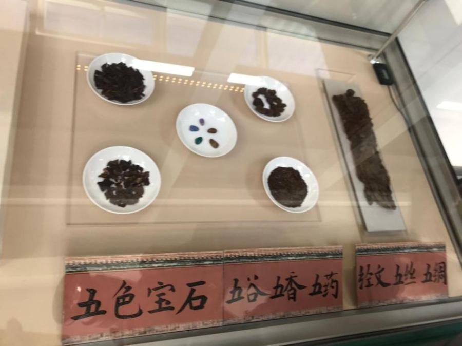 The photo shows things contained in “baoxia”, or ancient treasure box found at the main ridge of the roof of the Hall of Mental Cultivation in the Palace Museum in Beijing, China. Such boxes were placed in the ridge cylinder in the center of the main ridge on the roof as an item for suppressing evil. During ancient times, placement of the treasure box featured a grand ceremony to pray for safety.