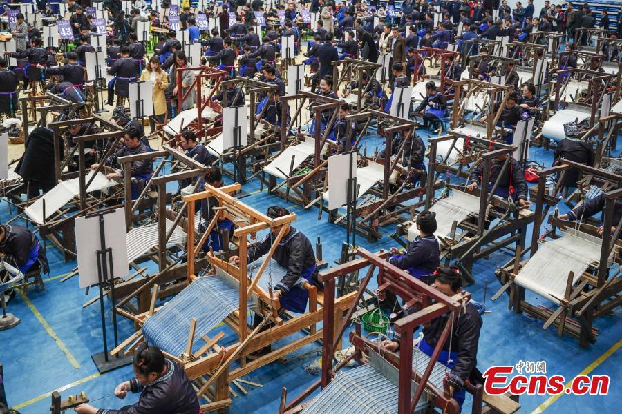 <?php echo strip_tags(addslashes(A competitor presents spinning skills during a manual skills competition held in Rongjiang County of Qiandongnan Miao and Dong Autonomous Prefecture, southwest China's Guizhou Province, on Nov. 15, 2018. A number of artisans from the county participated in the competition in aspects of spinning, weaving, wax printing, embroidery and so on.(Photo: China News Service/ He Junyi))) ?>