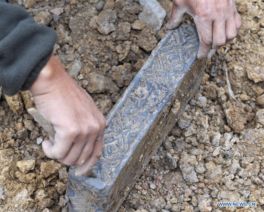 <?php echo strip_tags(addslashes(A worker cleans a brick from a tomb dated from the Eastern Han Dynasty (25-220) discovered in Chenghua District of Chengdu, capital of southwest China's Sichuan Province, Nov. 15, 2018. Altogether four tombs from the Eastern Han Dynasty (25-220) were discovered here in October this year, according to the Chengdu cultural relics and archeology research institute. (Xinhua/Liu Kun))) ?>
