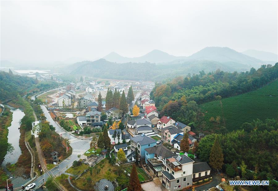 Aerial photo taken on Nov. 16, 2018 shows the scenery of Lujia Village in Anji County, east China\'s Zhejiang Province. Lujia Village is located in the mountainous region in northeastern Anji. The village has a population of over 2,200 and about 533 hectares of bamboo forests. To build a beautiful village and improve the living of local villagers, Lujia implemented a comprehensive plan for rural, industrial and tourism development in recent years. The income of the village\'s collective economy surged from 18,000 yuan (about 2,500 U.S. dollars) in 2011 to 3.3 million yuan (about 475,000 U.S. dollars) in 2017. The per capita income of local people arrives at 35,000 yuan (about 5,000 U.S. dollars). So far, the village has collective assets valued at nearly 200 million yuan (about 28.8 million U.S. dollars). (Xinhua/Meng Chenguang)