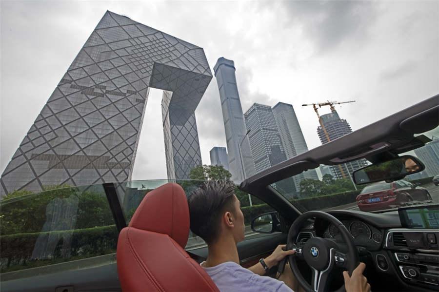 <?php echo strip_tags(addslashes(A young man drives a roadster through the CBD area in Beijing, Aug 5, 2018. (Photo provided to chinadaily.com.cn))) ?>