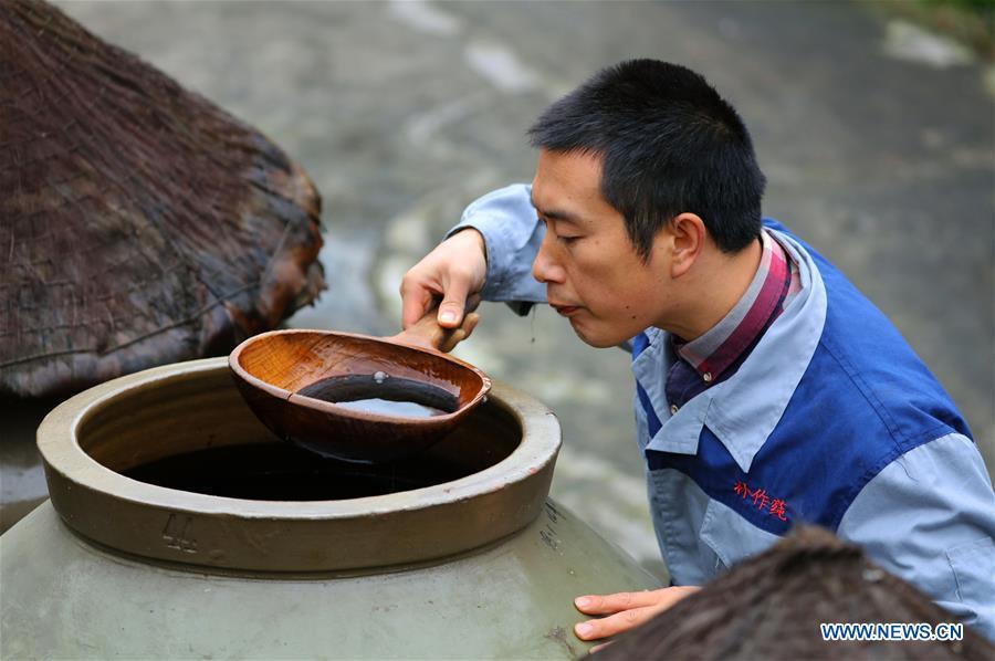 <?php echo strip_tags(addslashes(A worker checks vinegar aired in a jar at a vinegar plant in Chishui, southwest China's Guizhou Province, Nov. 18, 2018. Chishui maintained a traditional method to make vinegar with over 30 process steps.(Xinhua/Wang Changyu))) ?>