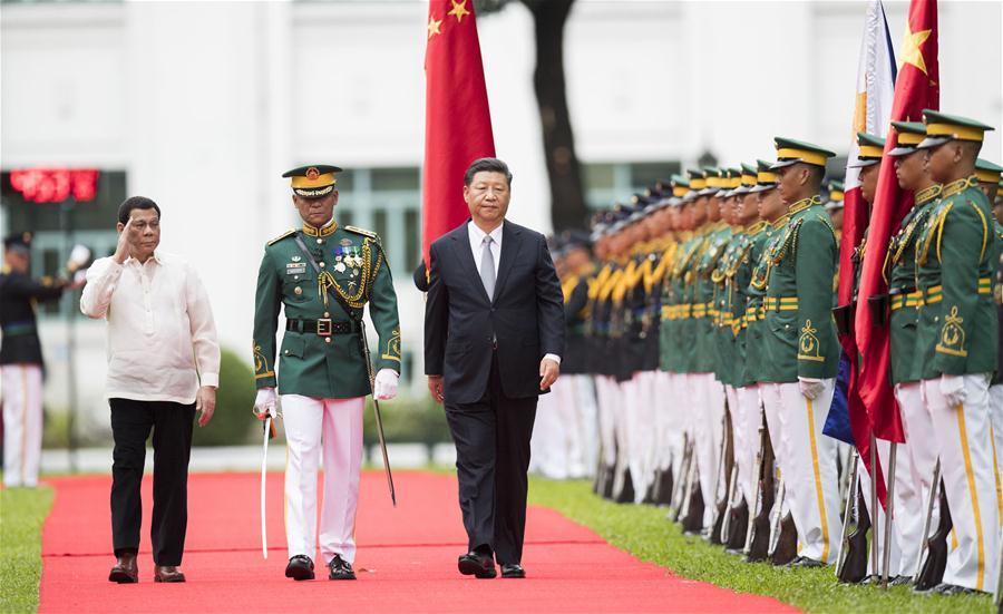 <?php echo strip_tags(addslashes(Chinese President Xi Jinping, accompanied by his Philippine counterpart Rodrigo Duterte, inspects the guard of honor in Manila, the Philippines, Nov. 20, 2018. Xi attended a welcome ceremony held by Duterte before their talks on Tuesday. (Xinhua/Huang Jingwen))) ?>