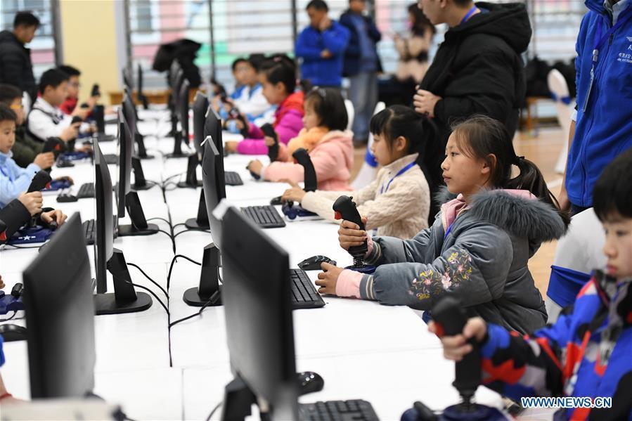 <?php echo strip_tags(addslashes(Students compete during the China Junior Flight Simulation Championships in Harbin, northeast China's Heilongjiang Province, Nov. 24, 2018. About 411 students of 46 teams took part in the two-day championships. (Xinhua/Wang Song))) ?>