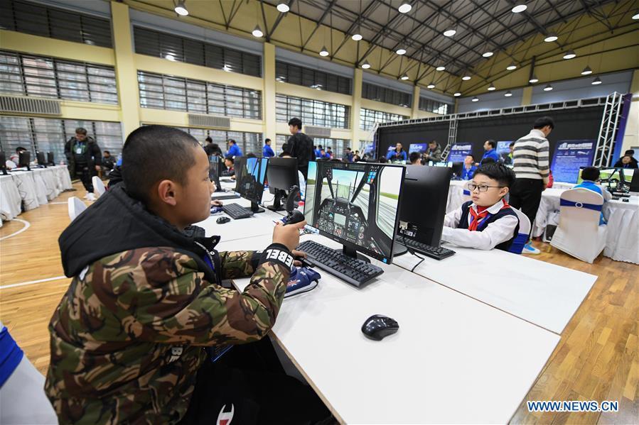 <?php echo strip_tags(addslashes(Students compete during the China Junior Flight Simulation Championships in Harbin, northeast China's Heilongjiang Province, Nov. 24, 2018. About 411 students of 46 teams took part in the two-day championships. (Xinhua/Wang Song))) ?>