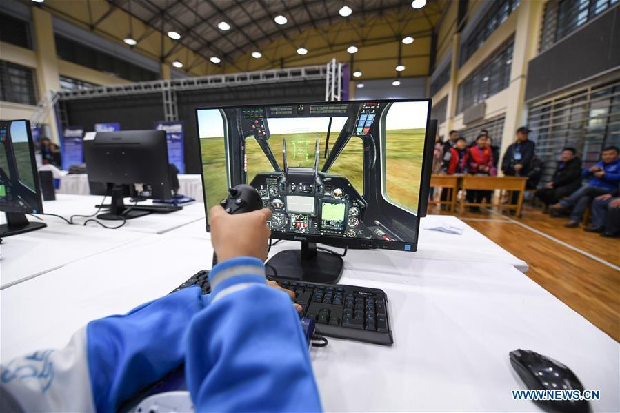<?php echo strip_tags(addslashes(A student competes during the China Junior Flight Simulation Championships in Harbin, northeast China's Heilongjiang Province, Nov. 24, 2018. About 411 students of 46 teams took part in the two-day championships. (Xinhua/Wang Song))) ?>