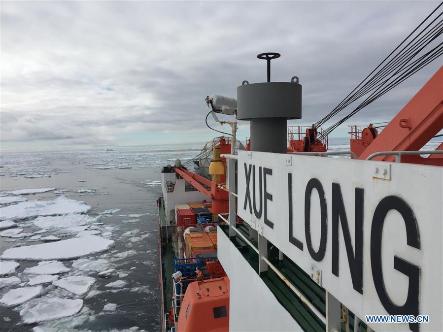 An iceberg and floating ice are seen in the Southern Ocean, Nov. 25, 2018. Xuelong entered a floating ice area in the Southern Ocean to avoid a cyclone. The ice area is located at 61.55 degrees south latitude and 110.37 east longitude. (Xinhua/Liu Shiping)