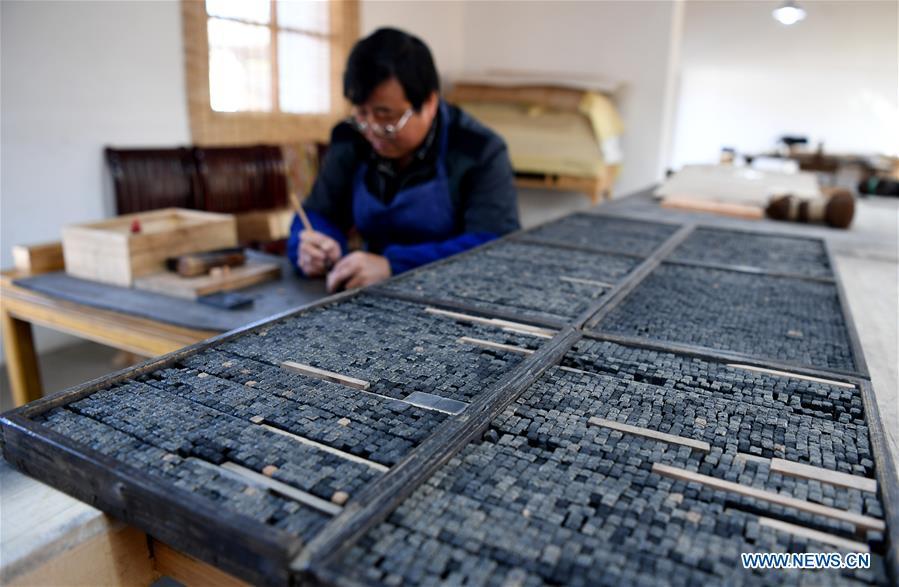 <?php echo strip_tags(addslashes(Lei Shitai works in Chanshan Village of Qinxi Town, Jingxian County, in east China's Anhui Province, Nov. 23, 2018. Lei, 52, born in neighboring Jiangxi Province, started his career as a typography printer when he finished his apprenticeship with his uncle who he followed since he was 17. The traditional printing method witnessed an increasingly hard time in the recent years as a livelihood. It was in 2017 when he decided to move to Chanshan at the invitation of Kai Yuanhong, a local cabinet maker, to cooperate in a broader way. Lei is now working with the traditional technique in a larger scale. (Xinhua/Liu Junxi))) ?>