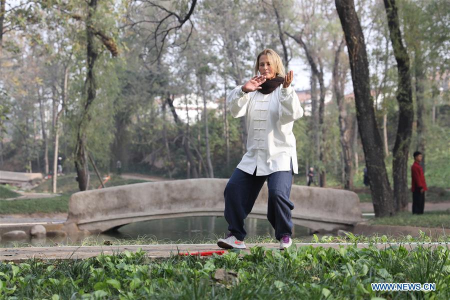 Ana Fidalgo practices Taiji in Chenjiagou Village of Wenxian County, central China\'s Henan Province, Nov. 20, 2018. Ana, who comes from Sao Paulo, Brazil, loves Chinese culture, and is a fan of Taiji. It\'s the third time that she comes to Chenjiagou Village to study Taiji. She has taught what she has learned in China in her hometown when coming back to Brazil in recent years, hoping to benefit more people. (Xinhua/Xu Hongxing)