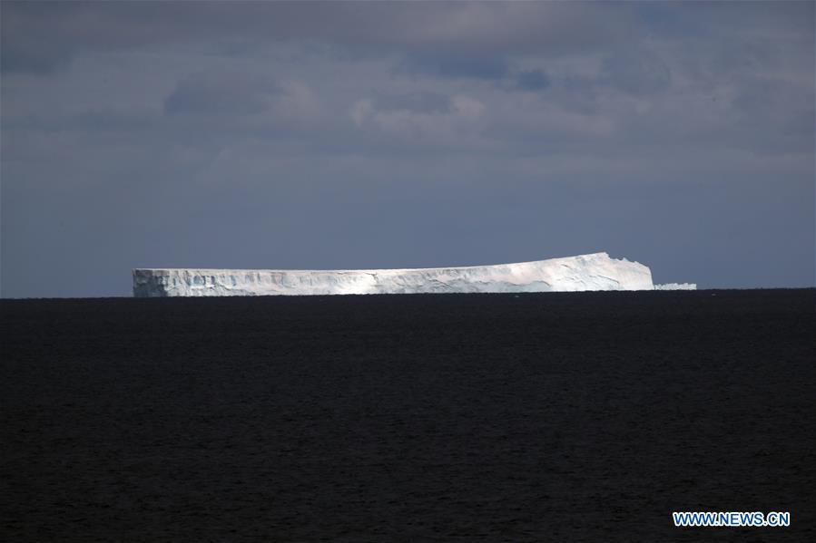 Photo taken on Nov. 27, 2018 shows iceberg seen from China\'s research icebreaker Xuelong in a floating ice area in Southern Ocean. China\'s research icebreaker Xuelong has entered a floating ice area in the Southern Ocean to avoid a cyclone. It is scheduled to reach the Zhongshan Station in Antarctica on Nov. 30. Also known as the Snow Dragon, the icebreaker carrying a research team set sail from Shanghai on Nov. 2, beginning the country\'s 35th Antarctic expedition which will last 162 days and cover 37,000 nautical miles (68,500 km). (Xinhua/Liu Shiping)
