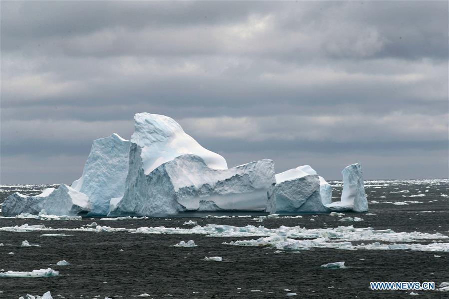 Photo taken on Nov. 26, 2018 shows iceberg seen from China\'s research icebreaker Xuelong in a floating ice area in Southern Ocean. China\'s research icebreaker Xuelong has entered a floating ice area in the Southern Ocean to avoid a cyclone. It is scheduled to reach the Zhongshan Station in Antarctica on Nov. 30. Also known as the Snow Dragon, the icebreaker carrying a research team set sail from Shanghai on Nov. 2, beginning the country\'s 35th Antarctic expedition which will last 162 days and cover 37,000 nautical miles (68,500 km). (Xinhua/Liu Shiping)