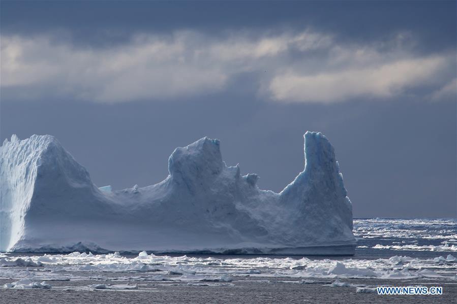 Photo taken on Nov. 27, 2018 shows iceberg seen from China\'s research icebreaker Xuelong in a floating ice area in Southern Ocean. China\'s research icebreaker Xuelong has entered a floating ice area in the Southern Ocean to avoid a cyclone. It is scheduled to reach the Zhongshan Station in Antarctica on Nov. 30. Also known as the Snow Dragon, the icebreaker carrying a research team set sail from Shanghai on Nov. 2, beginning the country\'s 35th Antarctic expedition which will last 162 days and cover 37,000 nautical miles (68,500 km). (Xinhua/Liu Shiping)
