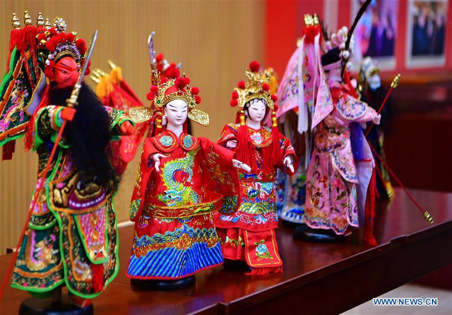 Photo taken on Nov. 28, 2018 shows wood puppet heads by Xu Zhuchu, a national-level intangible cultural heritage inheritor of Zhangzhou wood puppet head carving in Zhangzhou City, southeast China\'s Fujian Province. Listed as one of the national intangible cultural heritages in 2006, Zhangzhou wood puppet carving features exquisite craftsmanship. Xu\'s works of puppet head carving are known for rich and delicate facial expressions. Nowadays, Xu and his son, Xu Qiang, set up a studio of wood puppet to popularize local puppet culture. (Xinhua/Wei Peiquan)
