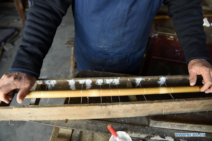 <?php echo strip_tags(addslashes(Liu Zesong, inheritor of the Yuping bamboo flute making craft, deals with bamboo materials for making a flute in Yuping Dong Autonomous County, southwest China's Guizhou Province, Nov. 29, 2018. As a traditional Chinese bamboo instrument, Yuping bamboo flute is famous for its clear tone and delicate carving. Made from local bamboo, the flute goes through dozens of procedures before finished and merges folk cultures of other ethnic groups. It was listed as one of the National Intangible Cultural Heritages in 2006. (Xinhua/Ma Ning))) ?>
