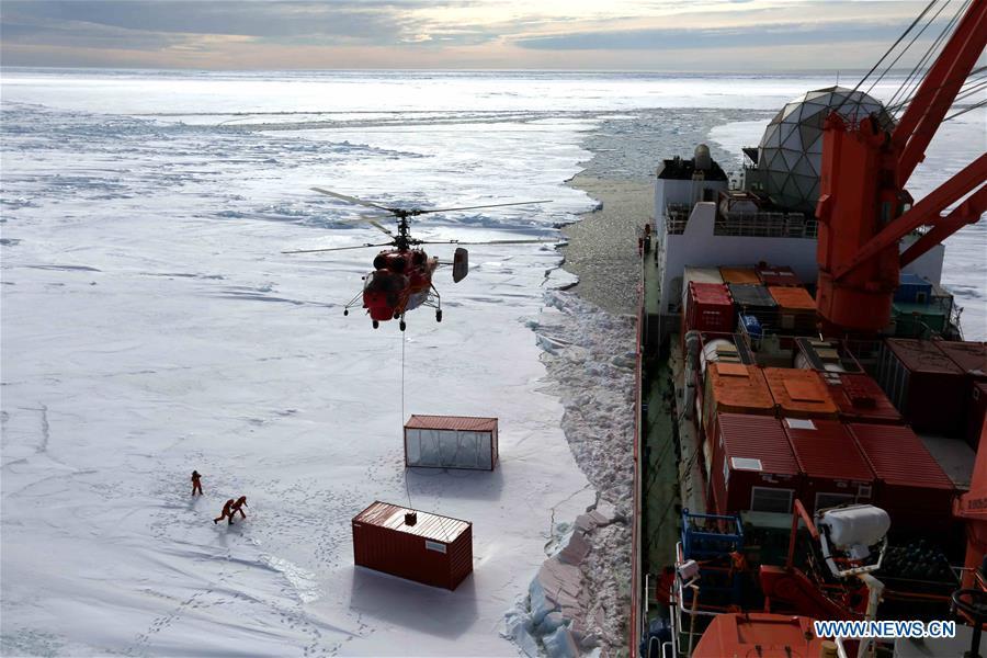 <?php echo strip_tags(addslashes(Members of the research team use the helicopter to unload cargo at the roadstead off the Zhongshan station in Antarctica, Dec. 1, 2018. China's research icebreaker Xuelong arrived at the roadstead off the Zhongshan station in Antarctica on Saturday. Unloading work has been carried out. Xuelong carrying a research team set sail from Shanghai on Nov. 2, beginning the country's 35th Antarctic expedition. (Xinhua/Liu Shiping))) ?>