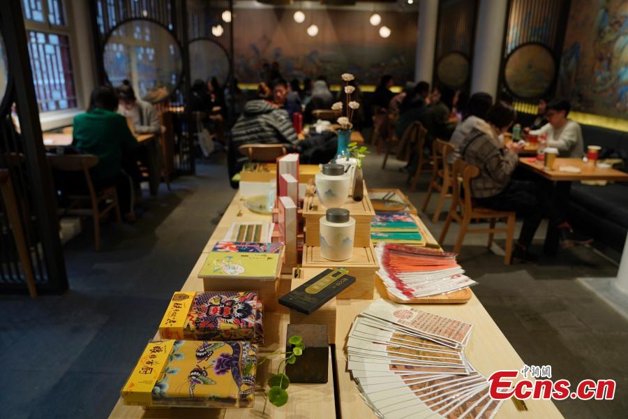 Visitors enjoy their drinks at a café newly opened outside the Palace Museum\'s Shenwu Men, or the Gate of Divine Might in Beijing on December 1, 2018. Named “Café by The Forbidden City”, the coffee shop in the theme of imperial China enables their customers to enjoy a wide range of drinks while experiencing ancient Chinese culture.  (Photo: China News Service/ Du Yang)