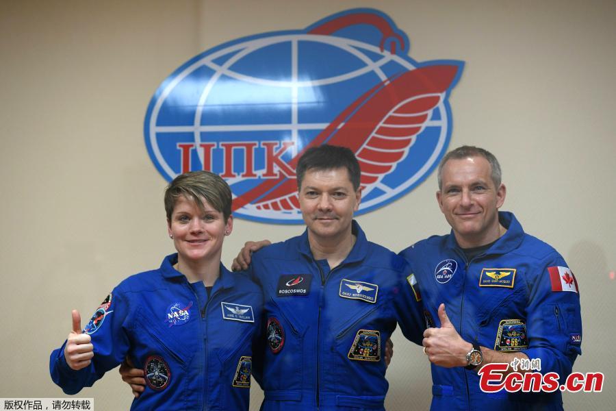 Members of the International Space Station (ISS) expedition 58/59 NASA US astronaut Anne McClain (L), Russian cosmonaut Oleg Kononenko (C) and David Saint-Jacques of the Canadian Space Agency pose during their press conference at the Russian-leased Baikonur cosmodrome in Kazakhstan on December 2, 2018.  The launch of the Soyuz MS-11 spacecraft with members of the International Space Station (ISS) expedition 58/59 is scheduled on December 3, 2018 from the Russian-leased Kazakh Baikonur cosmodrome. (Photo/Agencies)