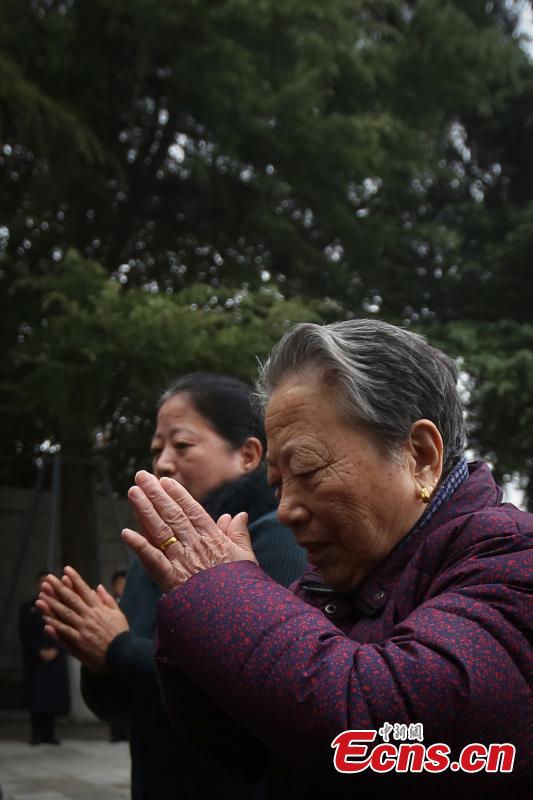 <?php echo strip_tags(addslashes(Survivor of the Nanjing Massacre Shi Xiuying, 92, pays tribute to the victims of the Nanjing Massacre before the memorial hall wall where the victims' names are engraved during commemoration activities in Nanjing, capital of east China's Jiangsu Province, Dec. 3, 2018. The Nanjing Massacre took place when Japanese troops captured the city on Dec. 13, 1937. Over six weeks, they killed 300,000 Chinese civilians and unarmed soldiers. In February 2014, China's top legislature designated December 13 as the national memorial day for victims of the Nanjing Massacre. Starting Monday, family members of the victims began a series of commemoration activities such as laying flowers, burning incense and reading letters in front of the Memorial Hall of the Victims in Nanjing Massacre by Japanese Invaders.(Photo: China News Service/Yang Bo))) ?>